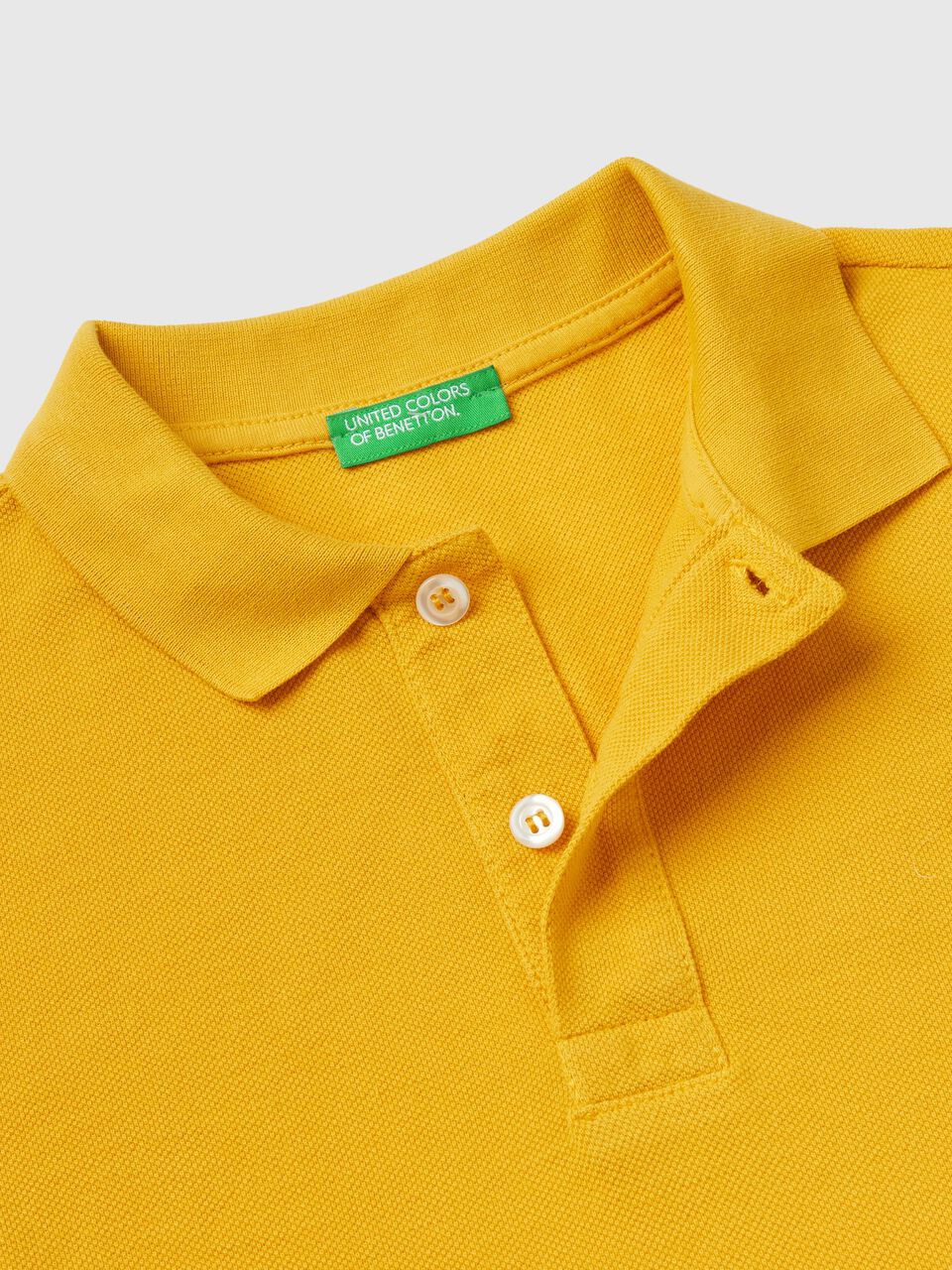 Polo aus 100% Bio-Baumwolle mit langen Ärmeln - Gelb | Benetton